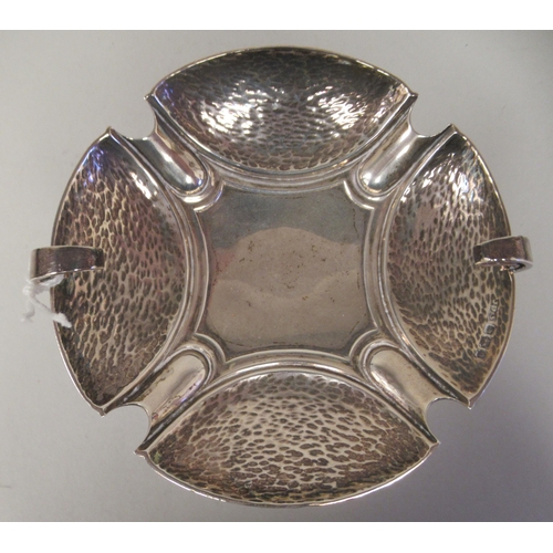 72 - An Art Nouveau silver pedestal sweet dish with opposing looped wire handles, elevated on a slender o... 