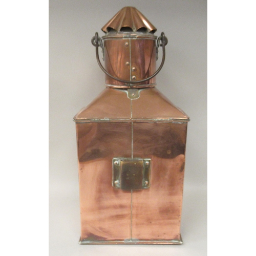 75 - A late 19th/early 20thC copper and brass cased ships stern lantern with a chimney and a clear, rib m... 