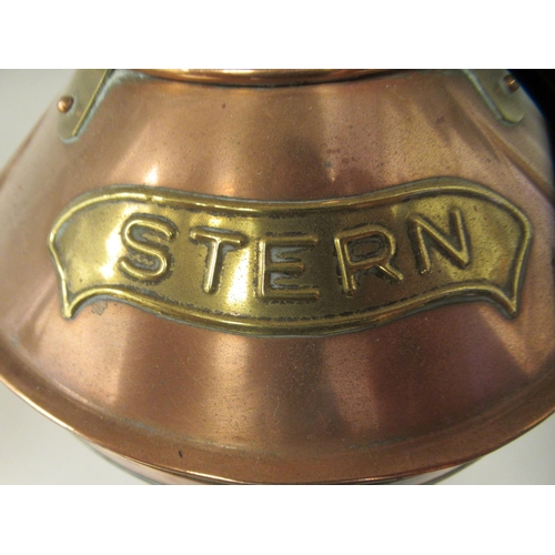 75 - A late 19th/early 20thC copper and brass cased ships stern lantern with a chimney and a clear, rib m... 