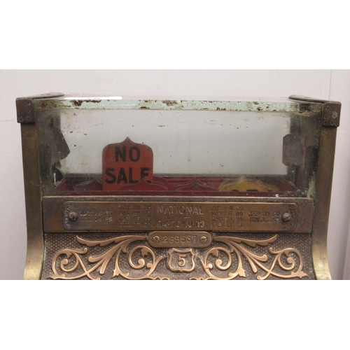 79 - A late 19thC National of Daytan, Ohio cast brass No.5 cash register with a lockable hinged cover, wi... 