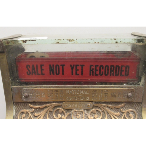 79 - A late 19thC National of Daytan, Ohio cast brass No.5 cash register with a lockable hinged cover, wi... 