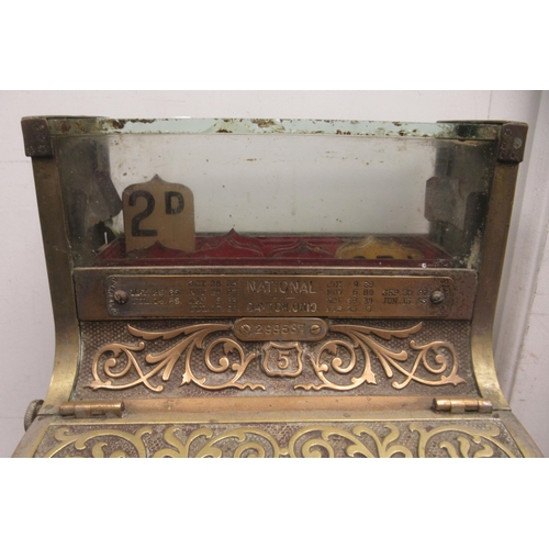 79 - A late 19thC National of Daytan, Ohio cast brass No.5 cash register with a lockable hinged cover, wi... 