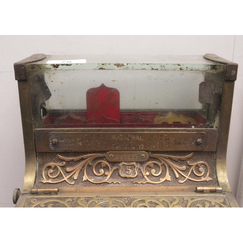 79 - A late 19thC National of Daytan, Ohio cast brass No.5 cash register with a lockable hinged cover, wi... 