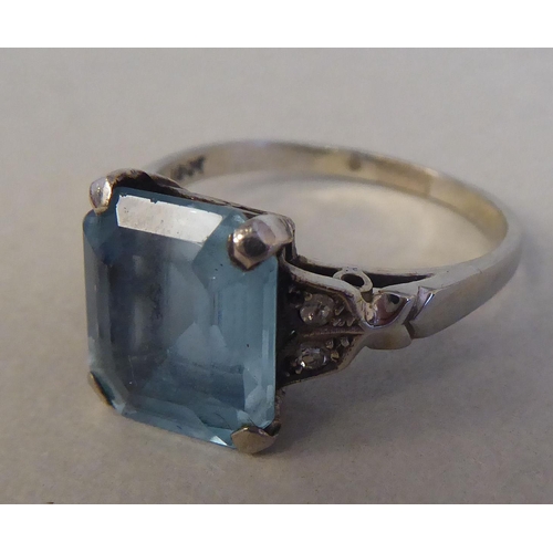 81 - A white gold claw set ring with a single stone aquamarine and diamond ring  stamped 18ct; and a whit... 