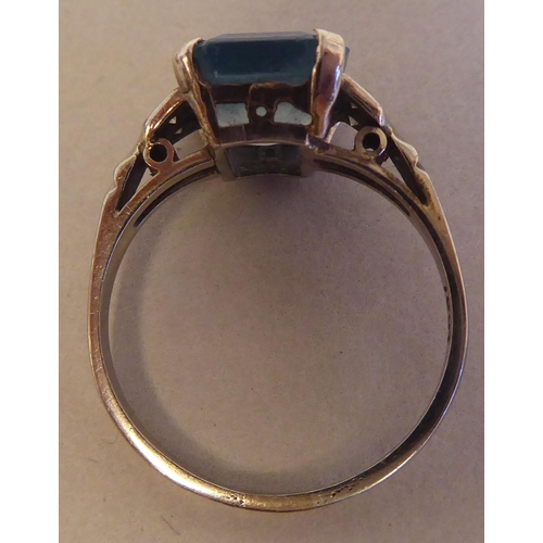 81 - A white gold claw set ring with a single stone aquamarine and diamond ring  stamped 18ct; and a whit... 