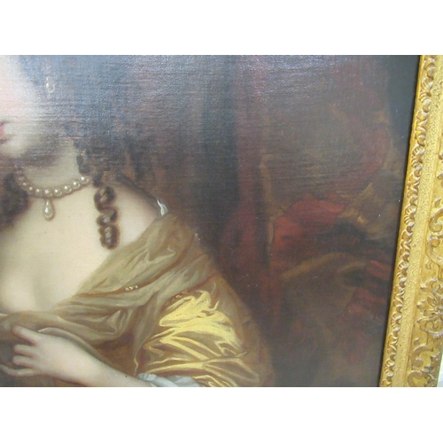 82 - In the manner of Peter Lely - a three-quarter length portrait, a woman wearing a gold coloured dress... 