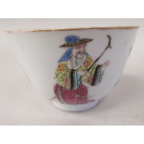 85 - An 18thC Chinese porcelain footed wine cup, decorated with a female and male figure and calligraphy ... 