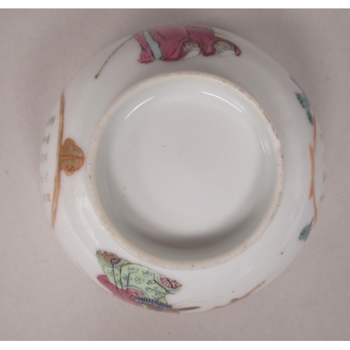 85 - An 18thC Chinese porcelain footed wine cup, decorated with a female and male figure and calligraphy ... 