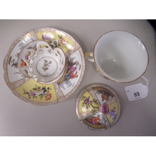 89 - A 19thC Augustus Rex style gilded porcelain twin handled chocolate cup and saucer, decorated with al... 