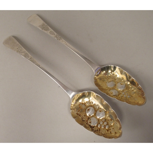 90 - A pair of George III Scottish silver and parcel gilt Old English pattern berry spoons with scratch e... 