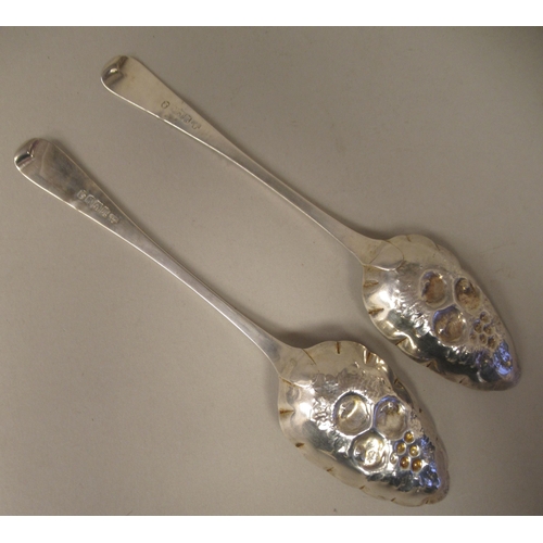 90 - A pair of George III Scottish silver and parcel gilt Old English pattern berry spoons with scratch e... 