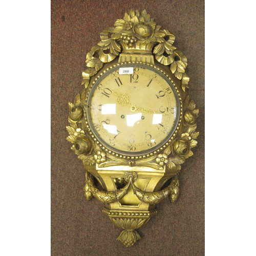 288 - A 19thC style wall clock in an ornate gilt case, decorated with ribbons, flora and garlands; the bel... 