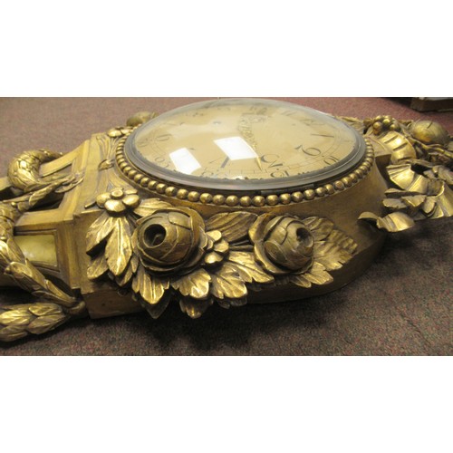 288 - A 19thC style wall clock in an ornate gilt case, decorated with ribbons, flora and garlands; the bel... 