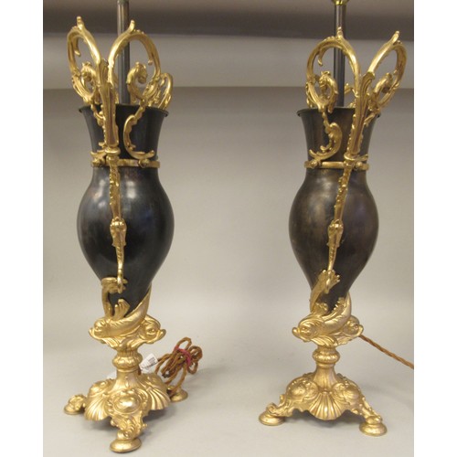 278 - A 20thC pair of Bradley & Hunt bronze finished and gilt metal pedestal table lamps of ovoid form... 