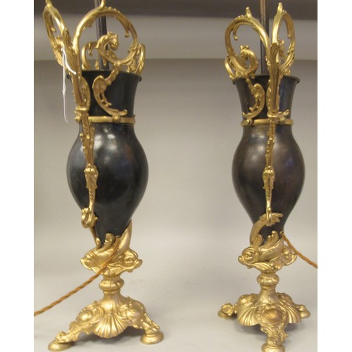 278 - A 20thC pair of Bradley & Hunt bronze finished and gilt metal pedestal table lamps of ovoid form... 