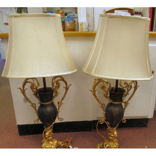 278 - A 20thC pair of Bradley & Hunt bronze finished and gilt metal pedestal table lamps of ovoid form... 