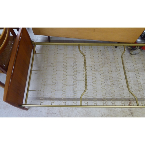 13 - A 1970s teak framed single bed, the headboard, on a sprung base  35