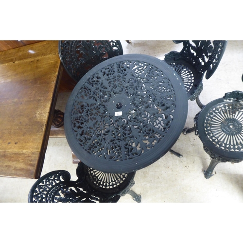 24 - A modern Victorian style green painted cast metal terrace table&nbsp; 28