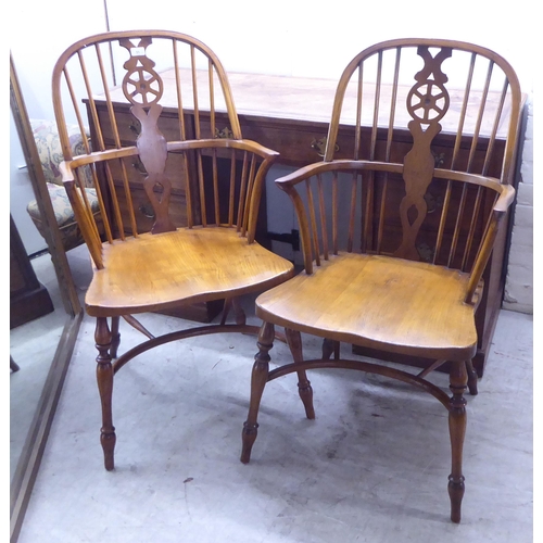 31 - Two pairs of late 19th/early 20thC beech and elm framed hoop, wheel, splat and spindle back Windsor ... 
