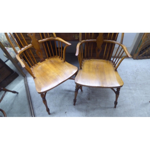 31 - Two pairs of late 19th/early 20thC beech and elm framed hoop, wheel, splat and spindle back Windsor ... 