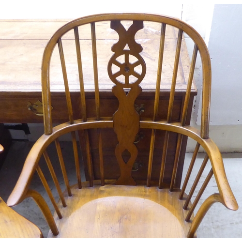 31 - Two pairs of late 19th/early 20thC beech and elm framed hoop, wheel, splat and spindle back Windsor ... 