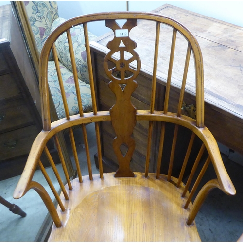 31 - Two pairs of late 19th/early 20thC beech and elm framed hoop, wheel, splat and spindle back Windsor ... 