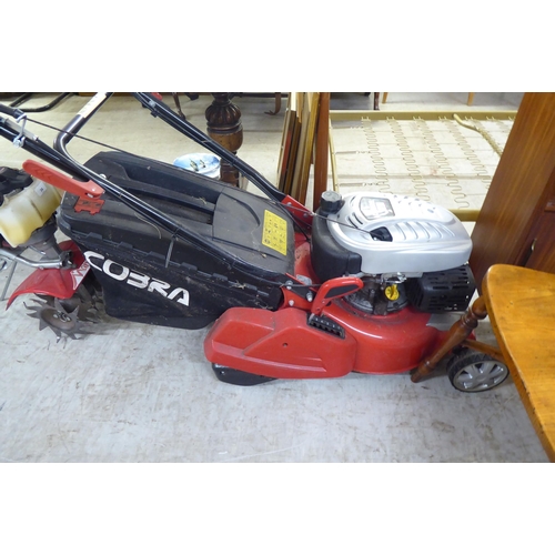 32 - A Honda 135cc petrol driven Cobra lawnmower with a 16