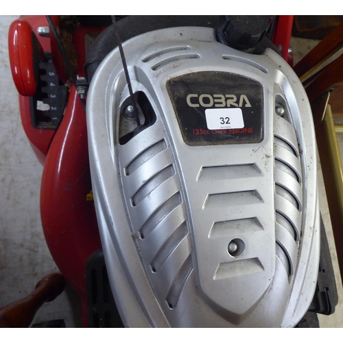 32 - A Honda 135cc petrol driven Cobra lawnmower with a 16