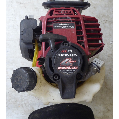34 - A Mantis Scarifyer with a Honda GX25 petrol engine&nbsp;