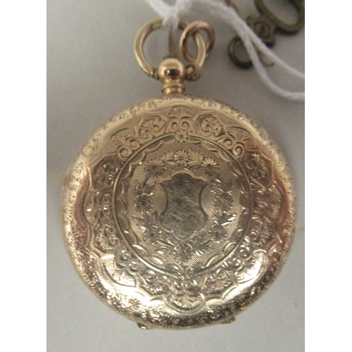45 - A 14ct gold cased fob watch with bright-cut engraved floral, scrolled and other ornament, faced by a... 
