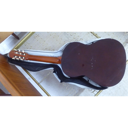 46 - A Yamaha six string acoustic guitar, model No. G.65A with a carrying case