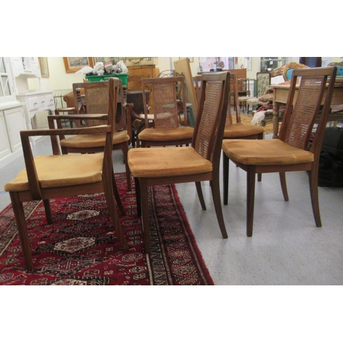 47 - A set of six G-Plan teak framed high back dining chairs with woven split cane panels and pink fabric... 