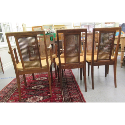 47 - A set of six G-Plan teak framed high back dining chairs with woven split cane panels and pink fabric... 