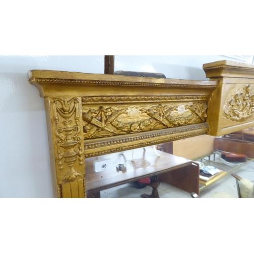 48 - A 19thC overmantle mirror, set in a decorated bead moulded gilt frame  63