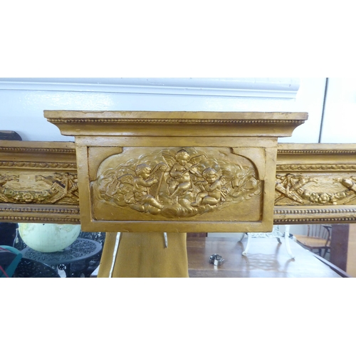 48 - A 19thC overmantle mirror, set in a decorated bead moulded gilt frame  63