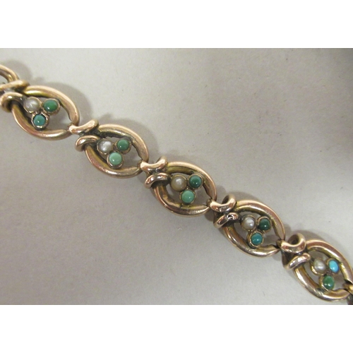 49 - A 9ct gold turquoise and pearl set charm link bracelet, on a bayonet clasp