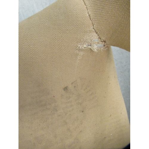 52 - A pair of 1960s moulded, mushroom coloured fabric upholstered office reception chairs, raised on tub... 