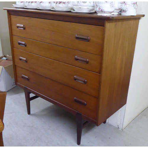 9 - A 1970s teak four drawer dressing chest, raised on tapered legs&nbsp; 41