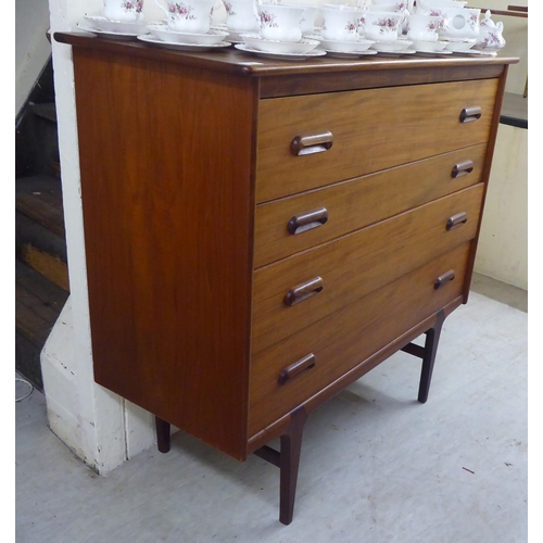 9 - A 1970s teak four drawer dressing chest, raised on tapered legs&nbsp; 41