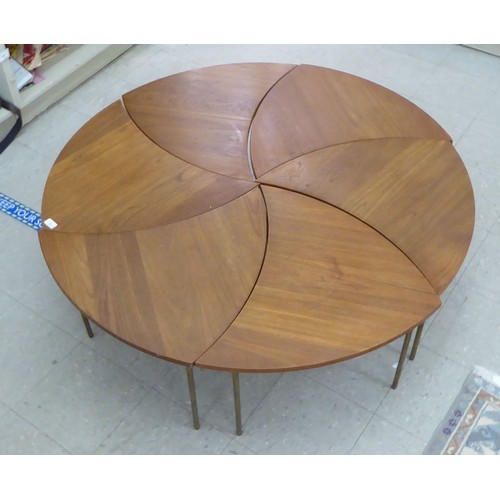 12 - A set of six 1960s Peter Hvidt & Olga Molgaard, pinwheel teak occasional tables, each raised on ... 
