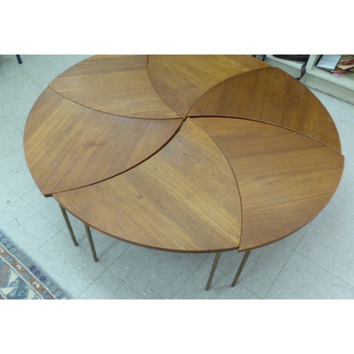 12 - A set of six 1960s Peter Hvidt & Olga Molgaard, pinwheel teak occasional tables, each raised on ... 