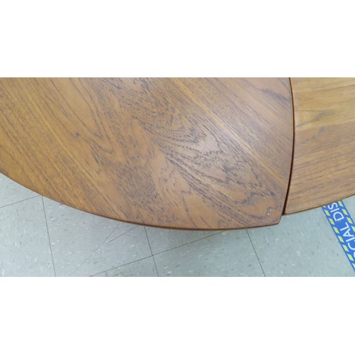 12 - A set of six 1960s Peter Hvidt & Olga Molgaard, pinwheel teak occasional tables, each raised on ... 