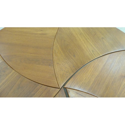 12 - A set of six 1960s Peter Hvidt & Olga Molgaard, pinwheel teak occasional tables, each raised on ... 