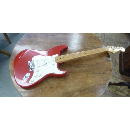 67 - A six string electric guitar