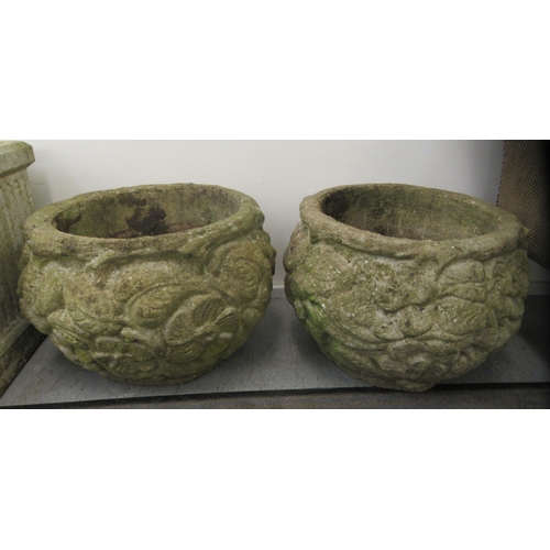 101 - A pair of composition stone planters of fish bowl form, decorated in relief with flora  13