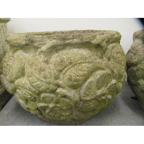 101 - A pair of composition stone planters of fish bowl form, decorated in relief with flora  13