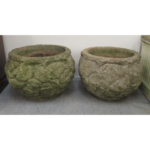 102 - A pair of composition stone planters of fish bowl form, decorated in relief with flora  13