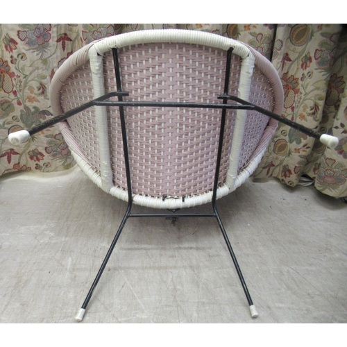 107 - A vintage design wicker effect tub chair, on tubular metal legs 