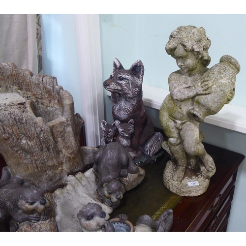 110 - Composition stone terrace ornaments: to include a fox group with a mother and two cubs  17