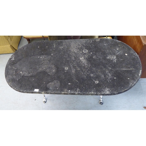 112 - A 20thC terrace table, the lozenge shape composition stone top, on a white painted cast iron underfr... 